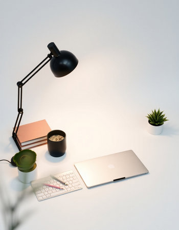 Modern workspace with laptop computer, coffee cup and notebook on white background. 3D Renderingの写真素材