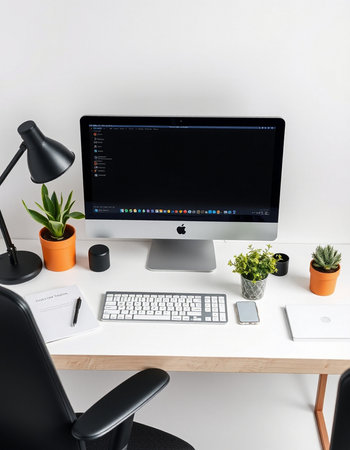 modern desktop with computer, supplies and stationery on table in office