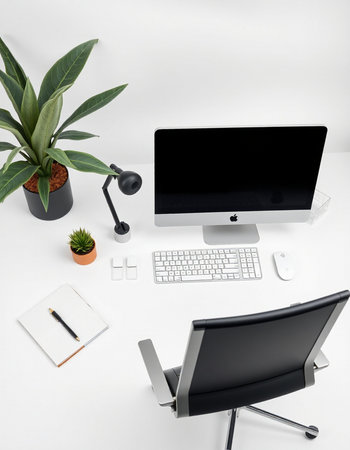 workplace with computer, notebook and plant on white background, top viewの写真素材