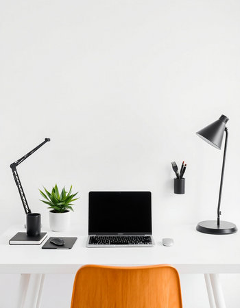 workplace with modern laptop, stationery and plant on white table