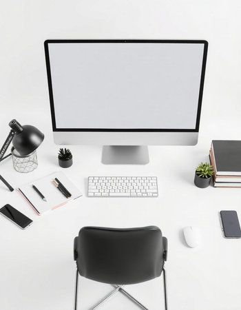 Modern workspace with computer, supplies and copy space on white background. 3D rendering.の写真素材