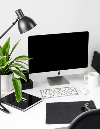 Modern workspace with computer, keyboard, mouse, coffee cup and plant on white background
