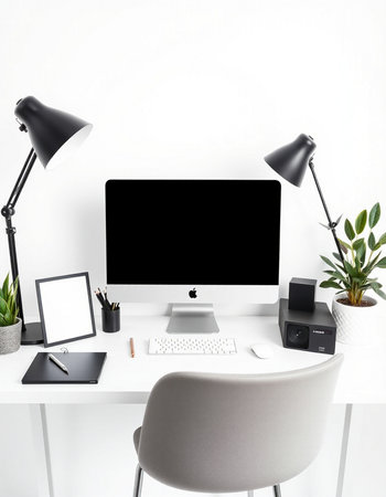 Workplace with computer, stationery, lamp and plants on tableの写真素材
