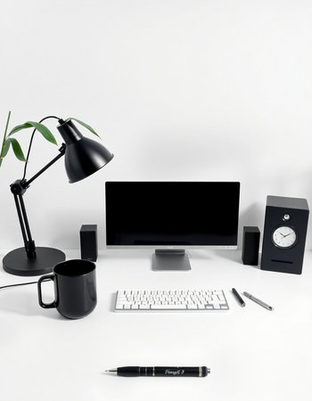 Modern workspace with computer, coffee cup, keyboard, mouse, alarm clock, stationery and plant on white backgroundの写真素材
