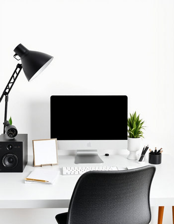 Minimalistic workspace with computer, stationery and photo frame on white wall. 3D Renderingの写真素材