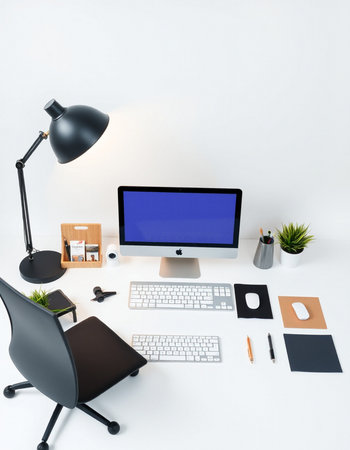 Workplace with computer, stationery and lamp on white background. 3D rendering.の写真素材