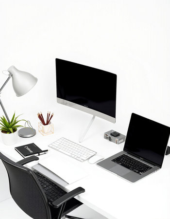 workplace with computer, lamp and coffee cup on white wall background