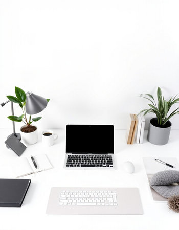 Minimal workspace with laptop, coffee cup, stationery and houseplant on white background. Workplace...