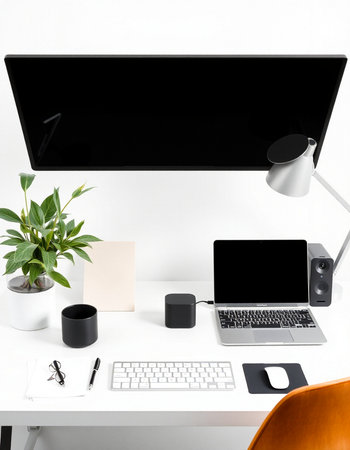 Modern workplace with computer, supplies and coffee cup on white background.