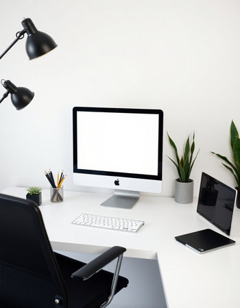 workplace with computer, tablet, smartphone and plant on white backgroundの写真素材