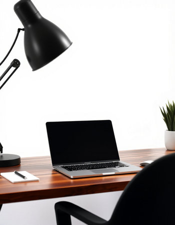 laptop with blank screen on wooden table and lamp on white background