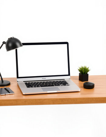 Modern workspace with blank screen laptop computer on wooden desk isolated on white backgroundの写真素材