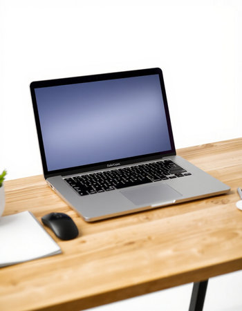 Laptop on wooden desk isolated on white background with clipping path.