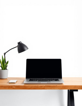 Laptop with blank screen on wooden table isolated on white background.