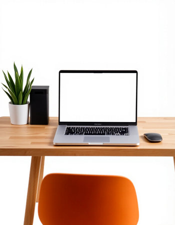 Laptop computer with blank screen on wooden desk isolated on white background
