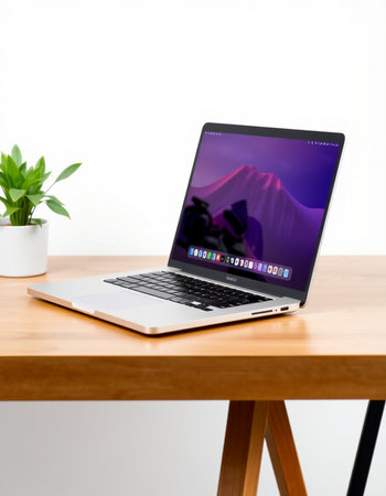 laptop on wood table and white wall background, working from home concept