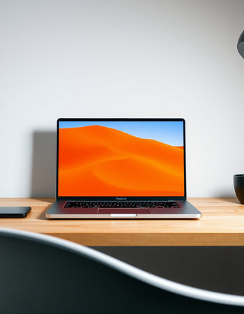 Laptop on table in modern office