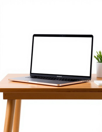 Laptop computer with blank screen on wooden table isolated on white background