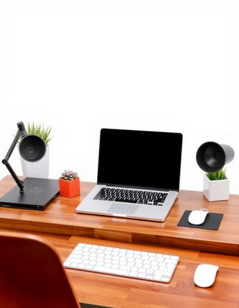 Modern workspace with laptop computer and office supplies on wooden desk isolated on white...