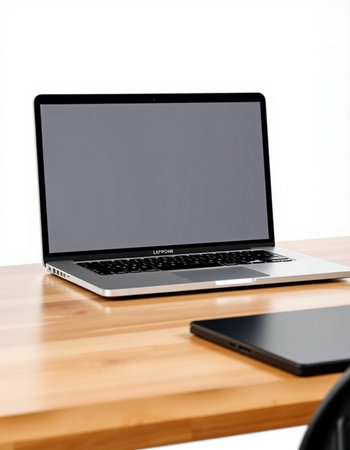 Laptop computer on wooden table isolated on white background with clipping path