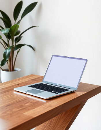 Laptop with blank screen on a wooden table. 3d renderingの写真素材