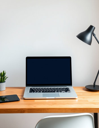 Laptop with blank screen on wooden desk in office, stock photoの写真素材