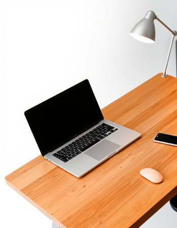 Laptop and smartphone on wooden desk with copy space for your text