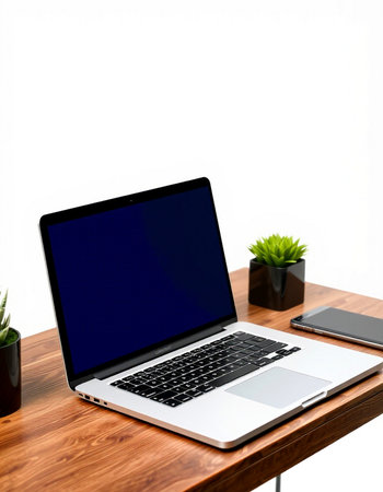 Laptop computer on wood desk with white wall background, stock photoの写真素材