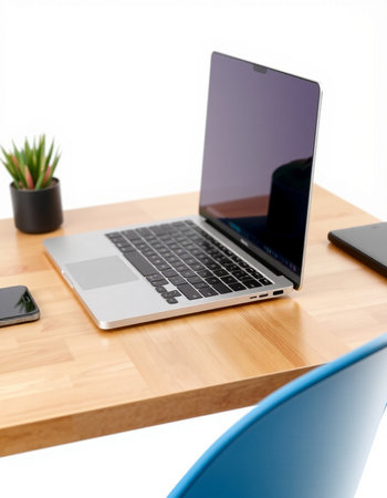Laptop computer on wood desk isolated on white background with clipping pathの写真素材