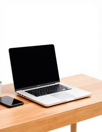 Laptop computer on wooden desk isolated on white background with clipping path