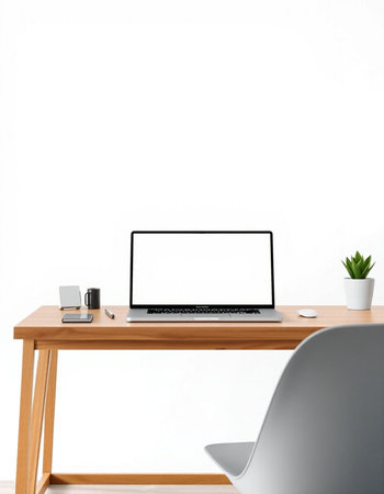 Modern workspace with blank screen laptop computer on wooden table and white wall background