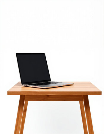 Laptop computer on wooden table isolated on white background with clipping path
