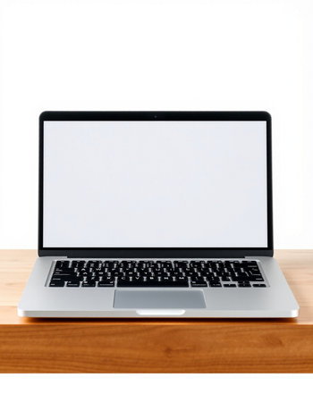Laptop with blank screen on wood table isolated on white background.