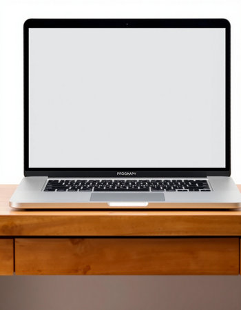 Laptop with blank screen on a wooden table isolated on white background