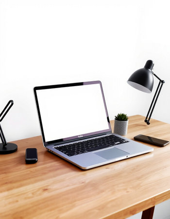 Laptop with blank screen on wooden table. Workplace concept.