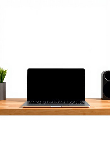 Laptop with black screen on wooden shelf and white wall background.