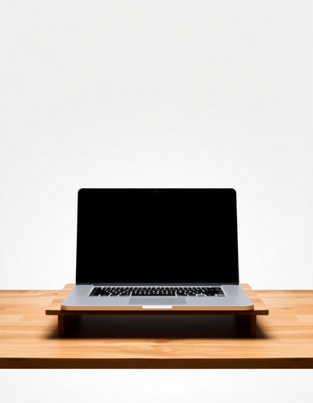 Laptop on wooden table. Isolated on a white background.の写真素材