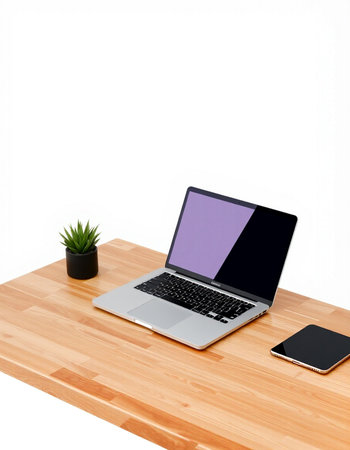 Laptop on wooden desk isolated on white background.の写真素材