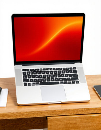 Laptop on wood desk and white wall background with red screen.