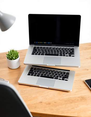 Close up of modern workplace with blank laptop computer on wooden table.の写真素材