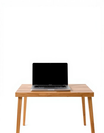 Laptop with blank screen on wooden table isolated on white background.の写真素材