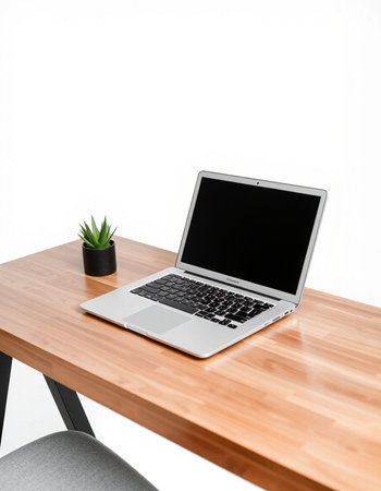 Laptop on wooden table isolated on white background with clipping path.
