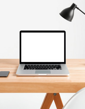 Close up of modern designer desktop with blank white laptop screen, smartphone and lamp. Mock up, 3D...