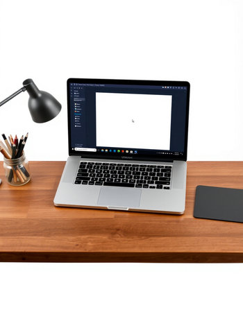 Laptop with blank screen on a wooden desk isolated on white background