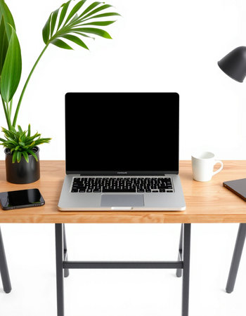 Modern workspace with blank screen laptop computer on wooden desk, clipping path included