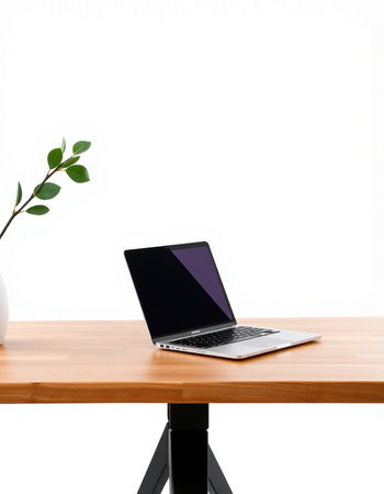 Laptop on wooden desk isolated on white background with clipping path.の写真素材