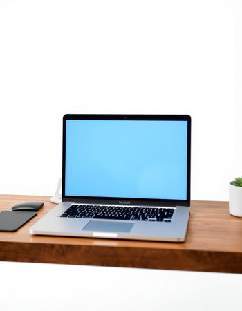Laptop computer with blank screen on wood table isolated on white background