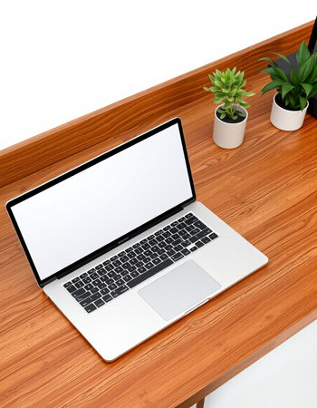Laptop computer on wooden table isolated on white background with clipping path