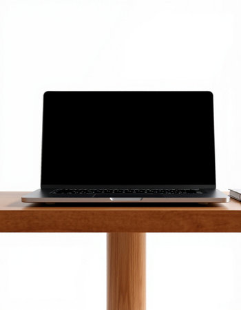 Laptop computer with blank screen on wooden table isolated on white backgroundの写真素材