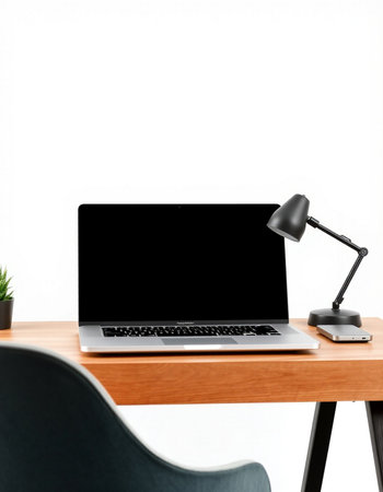 Laptop computer with blank screen on wooden table and black chair on white background